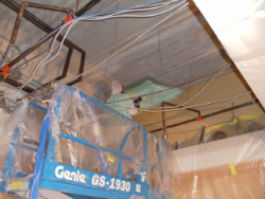 lift and applying spray foam insulation